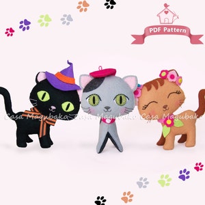 May include: Three felt cat toys, each with a different personality. The black cat wears a witch's hat, the grey cat wears a beret, and the brown cat wears a flower crown.  PDF Pattern.