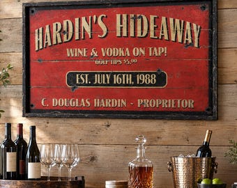 May include: A rectangular wooden sign with a distressed red finish and black frame. The text reads: HARDIN'S HIDEAWAY, WINE & VODKA ON TAP!, GOLF TIPS $5.00, EST. JULY 16TH, 1988, and C. DOUGLAS HARDIN - PROPRIETOR in bold, weathered lettering.