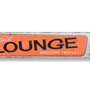 a sign that says lounge welcome friends