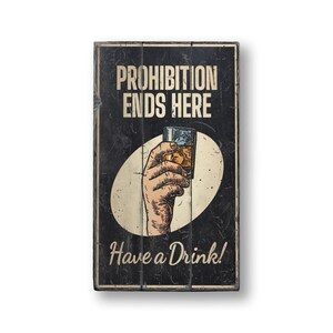 a sign that says prohibition ends here have a drink