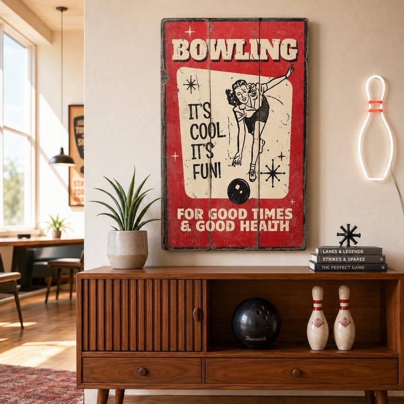 May include: A rectangular wall sign with a red background and a cream-coloured centre panel featuring a black illustration of a person bowling. The text reads BOWLING IT'S COOL IT'S FUN! FOR GOOD TIMES & GOOD HEALTH with star accents.