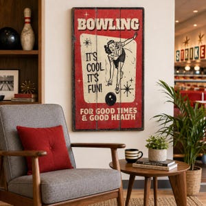 May include: A rectangular wooden wall sign with a red background and a vintage-style illustration of a person bowling. The text reads BOWLING, IT'S COOL, IT'S FUN!, and FOR GOOD TIMES & GOOD HEALTH. The sign features a cream-coloured central panel.
