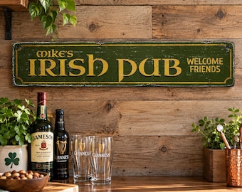 May include: A rectangular green wooden sign with a distressed finish featuring the gold text Mike's IRISH PUB and WELCOME FRIENDS. The sign has a thin gold border and is mounted horizontally, displaying a weathered appearance with visible wood grain.
