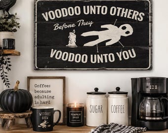 May include: A rectangular black wooden sign with white text that reads Voodoo Unto Others Before They Voodoo Unto You. The sign features a white graphic of a candle and a voodoo doll with pins. The design has a distressed, weathered appearance.