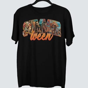 May include: Black t-shirt featuring the text "Summerween" in an orange and blue gradient font. The word "Summer" is filled with images of horror movie characters. The shirt is a short-sleeved crew neck.