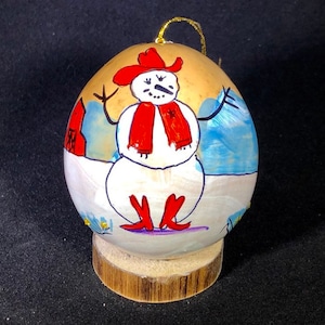 Western snowman ornament. Hand–painted Gourd Christmas Ornament by artist Sandy Short www.handpaintedgourds.com. Original artwork. Light wei