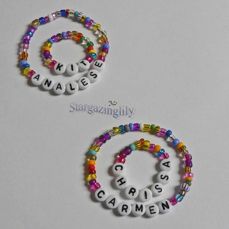 May include: Two colorful beaded bracelets with the names "Analise" and "Chrissa Carmen" spelled out in white beads.