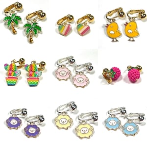 May include: Assortment of colorful clip-on earrings featuring various designs, including palm trees, cacti, hearts, chicks, sheep, and raspberries.