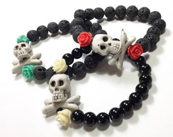 Skull and Cross Bones Diffuser Bracelet with red roses. Made with Lava stone or Black pearls. Halloween Jewelry Day of the Dead Goth Jewelry