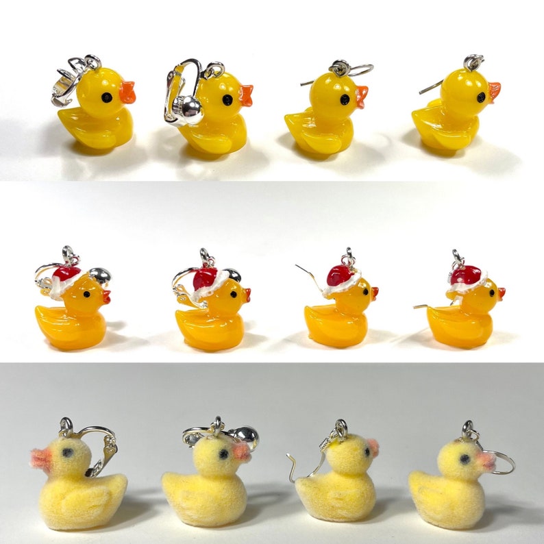 May include: A set of 10 yellow rubber duck earrings. Some of the ducks are wearing Santa hats. The earrings are perfect for adding a touch of whimsy to any outfit.