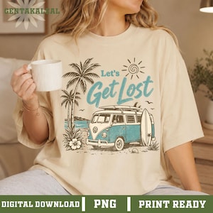 May include: A cream-colored t-shirt featuring a graphic print of a blue and white vintage van parked on a beach with palm trees, a surfboard, and a sun. The text Let's Get Lost is printed in blue above the van. The shirt has short sleeves.