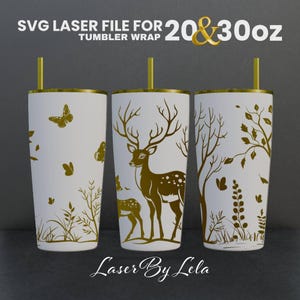 May include: SVG laser file for 20 & 30 oz tumbler wrap featuring a deer and fawn in a forest setting with butterflies and foliage. The design is in gold on a white background.