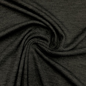 May include: Close-up of a dark gray, textured fabric with a soft, drapey feel. The fabric is wrinkled and folded, showing its flexibility.
