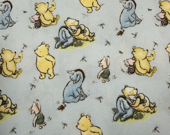 Winnie the Pooh and Friends on Blue 1 mil PUL Fabric - Made in the USA
