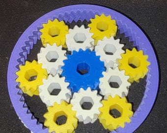 May include: A purple gear with a blue, white, and yellow gear set inside. The gear set is labeled "Style H - 4 Colors".