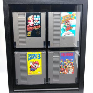 Super Mario Bros 1 2 3 and Dr Mario collection Nintendo Entertainment System NES cartridges framed retro JRPG video game wall art game room
