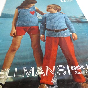 May include: A vintage knitting pattern booklet featuring two children wearing blue sweaters and red pants. The cover features the text "BELLMANS double knitting Sizes 22 to 26".