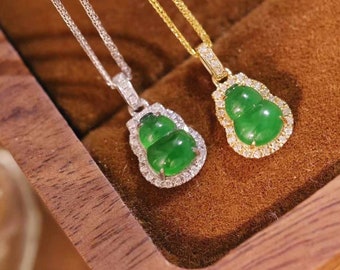 May include: Two jade pendant necklaces with diamond accents. The pendants are shaped like gourds and are set in silver and gold.