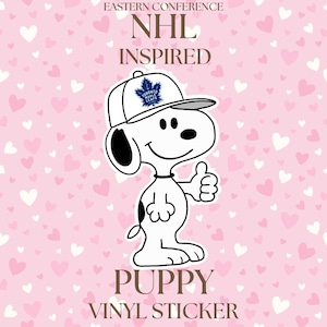 May include: A white vinyl sticker of a cartoon puppy wearing a white baseball cap with a Toronto Maple Leafs logo. The puppy gives a thumbs-up gesture. The sticker is on a pink background with heart shapes and the text "Eastern Conference NHL Inspired Puppy Vinyl Sticker."