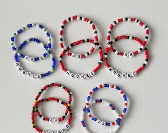 Juego de 2 pulseras de cuentas personalizadas con número y apellido inspirados en jugadores de la NHL