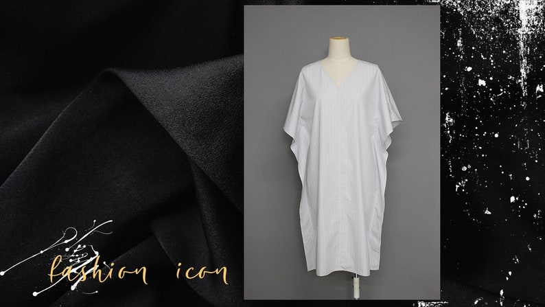 May include: A white and gray striped kaftan with a V-neckline. The kaftan is made of a lightweight fabric and has a relaxed fit.