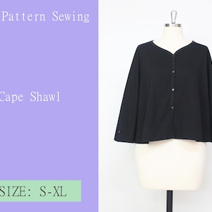 May include: A black cape shawl on a mannequin. The shawl features a V-neck and button closure. Text on the image reads "PDF Pattern Sewing", "Cape Shawl", and "SIZE: S-XL".
