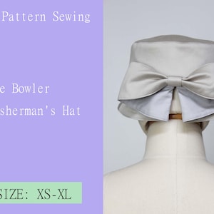 May include: A gray felt bowler hat with a large bow on the back. The hat is on a white mannequin. The text "The Bowler Fisherman's Hat" and "SIZE: XS-XL" is on a purple background.