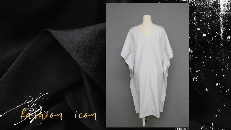 May include: A white and gray striped kaftan-style dress with a V-neckline. The dress is on a white mannequin.