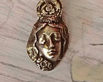 Fine silver goddess with fish emblem as bail