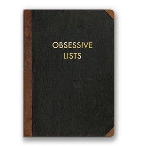 May include: A black leather-bound notebook with a brown leather spine and the words "OBSESSIVE LISTS" printed in gold on the front cover.