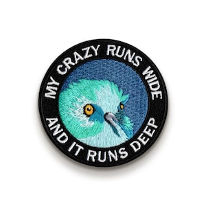 May include: A black and white embroidered patch with a blue bird and the text "My crazy runs wide and it runs deep".