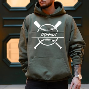 May include: A green hooded sweatshirt with a white baseball graphic and the name "Michael" printed on it.