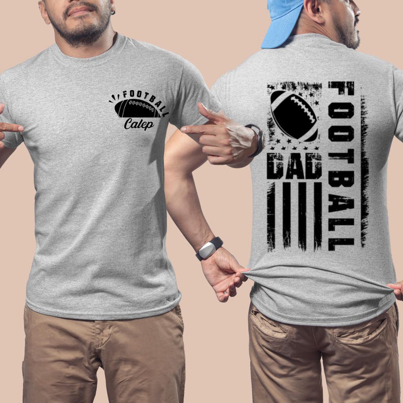 May include: A gray t-shirt with a black football graphic and the text "Football Caleb" on the front. The back of the shirt features a black and white American flag design with the text "Football Dad" in a vertical orientation.