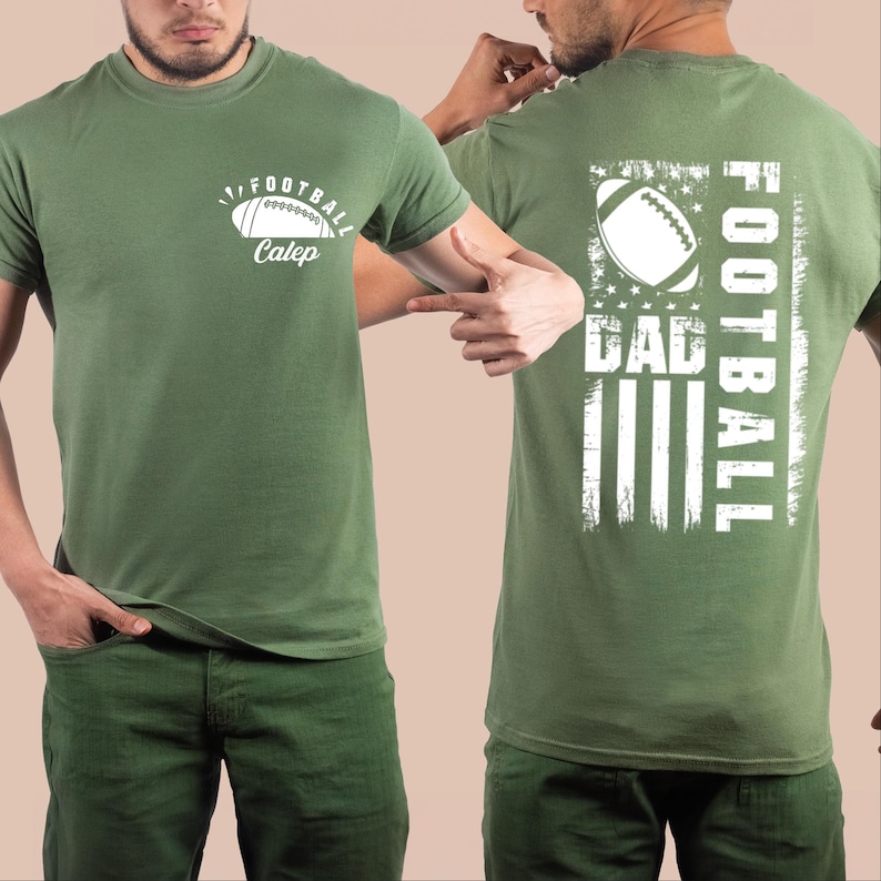 May include: A green t-shirt with a white football design and the text "Football Caleb" on the front. The back of the shirt has a white American flag design with the text "Football Dad" on the right side.