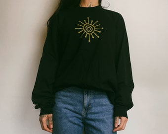 Schwarzes Longsleeve T-Shirt mit Gold Motiven