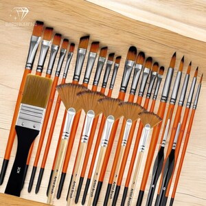 May include: A set of 20 paint brushes with wooden handles and silver ferrules. The brushes are arranged in two rows, with the larger brushes in the front and the smaller brushes in the back. The brushes are labeled with numbers indicating their size. The brushes are on a wooden surface.