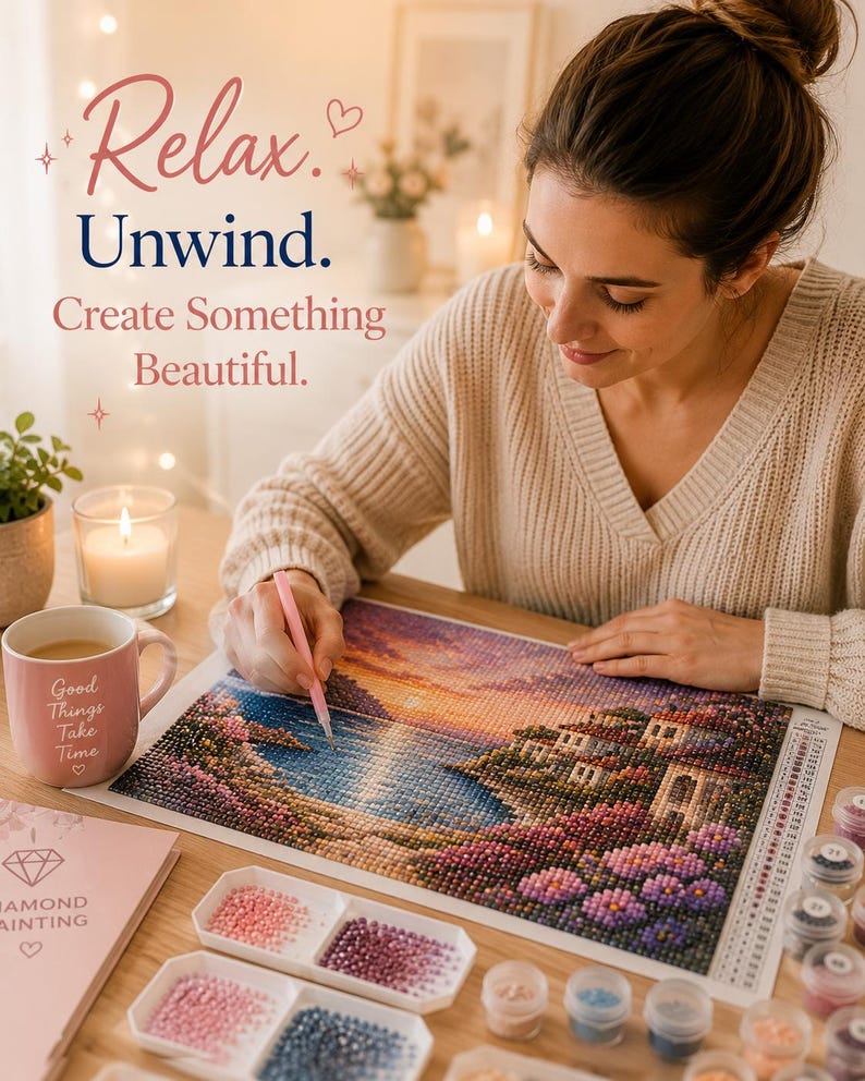 May include: A diamond painting kit featuring a sunset coastal scene with a house, a pink mug with the text Good Things Take Time, a pink stylus, and small containers of colorful beads. The text Relax. Unwind. Create Something Beautiful. is visible.