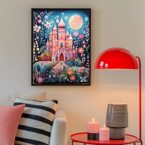 May include: A rectangular wall art print featuring a pink castle with multiple towers set against a dark blue night sky with a large full moon. The scene is surrounded by stylized flowers and foliage in shades of pink, blue, and orange.