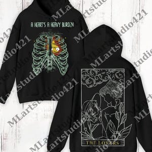 a black hoodie with a picture of a skeleton on it