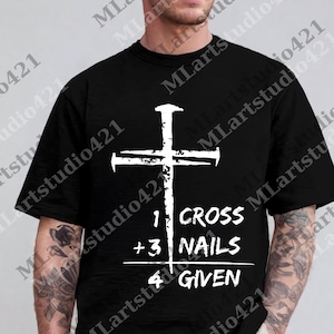 May include: Black t-shirt with a white cross graphic and the text "1 CROSS + 3 NAILS = 4 GIVEN". The design features a simple, bold cross with nail details.