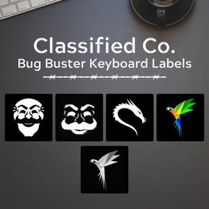 May include: Five black square keyboard labels with white images. The labels feature a white masked face, a white masked face with a glitch effect, a white dragon, a colourful parrot, and a white parrot.