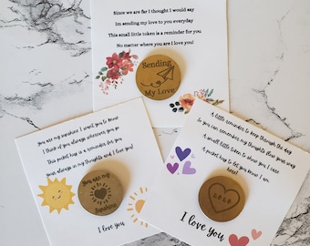May include: Three cards with messages of love and small round gold tokens with different designs. The first card has a floral design and the token says "Sending My Love". The second card has a sun design and the token says "You are my Sunshine". The third card has a heart design and the token says "xoxo".