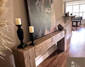 An entryway table made of rugged, textured reclaimed barn wood featuring a unique dovetail old wood rustic design table loft The MFW