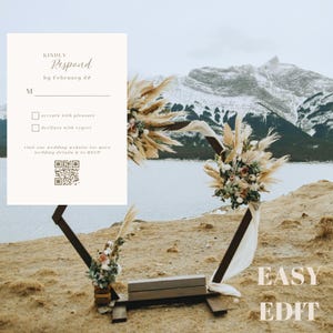 May include: A white RSVP card with a brown border and a QR code. The card has the text "KINDLY Respond by February 22" and two options: "accepts with pleasure" and "declines with regret". The card is placed in front of a wooden arch decorated with dried flowers and a white fabric.