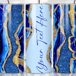 May include: Three stainless steel tumblers with a blue and gold agate pattern. The center tumbler has the text "Your Text Here" in blue.