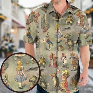 May include: Short-sleeved button-down shirt featuring a repeating pattern of illustrations from Alice in Wonderland. The design includes Alice, the Mad Hatter, the Cheshire Cat, and other characters in a whimsical, vintage style.
