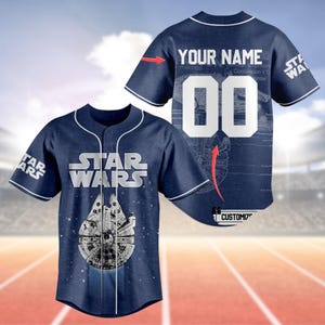May include: A blue baseball jersey with white trim. The front of the jersey features a white "Star Wars" logo and a white image of the Millennium Falcon. The back of the jersey has a white number "00" and the text "Your Name".