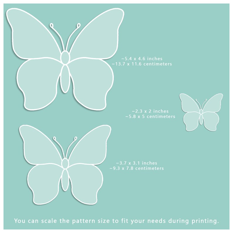 May include: Three white butterfly outlines on a light blue background. The butterflies are different sizes. The text below the butterflies reads: "You can scale the pattern size to fit your needs during printing."