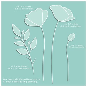 May include: A digital illustration of three white flowers on a light blue background. The flowers are outlined in white and have a shadow effect. The image includes measurements in inches and centimeters for each flower.