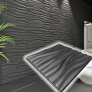 Può includere: Un pannello da parete 3D nero con un motivo a onde. Il pannello è realizzato in un materiale testurizzato e ha un design moderno.